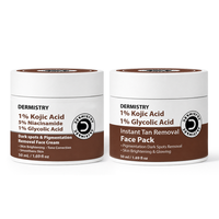 Two white cosmetic jars with brown labels from the brand Dermistry, shown side by side on a white background. The left jar is labeled Dark spots & Pigmentation Removal Face Cream, and the right jar is labeled Instant Tan Removal Face Pack.
