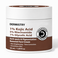 A white plastic jar of Dermistry 1% Kojic Acid 5% Niacinamide 1% Glycolic Acid Dark spots & Pigmentation Removal Face Cream, featuring a brown and white label.