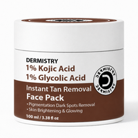 A white plastic jar of Dermistry Instant Tan Removal Face Pack with a brown and white label, set against a plain white background.