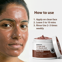 A close-up of a woman's face wearing a dark brown face mask, next to an open jar of Dermistmy 1% Kojic Acid 1% Glycolic Acid Instant Tan Removal Face Pack, with a 'How to use' instruction list on a white background.