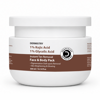 A white plastic jar of Dermistry Instant Tan Removal Face & Body Pack with a brown and white label, set against a plain white background.