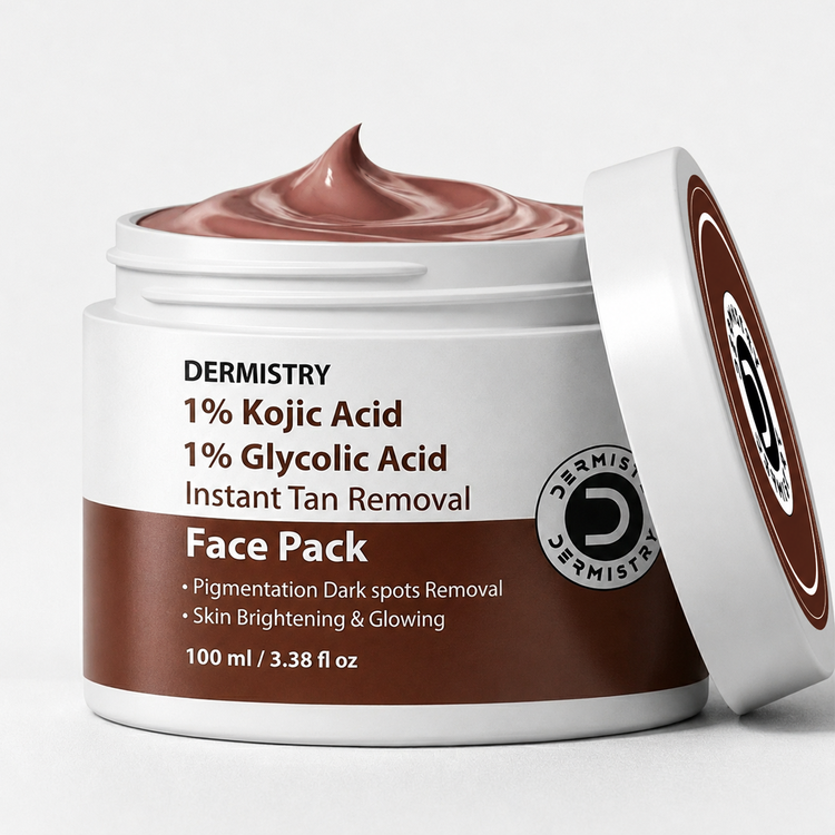 A jar of Dermistry Face Pack instant tan removal cream with its lid leaning against it, showing the brown cream inside. The label is white and brown with text detailing the ingredients: 1% Kojic Acid and 1% Glycolic Acid.